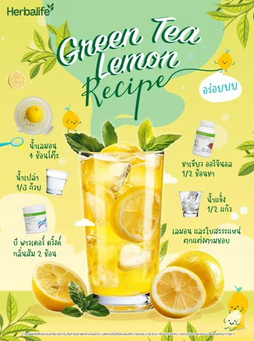 Iced orange drink with mint beside a tub of drink powder and a halved orange (3/4)